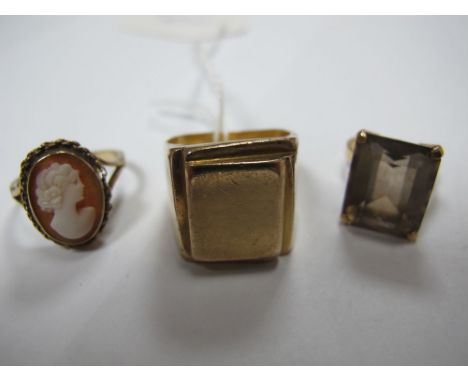 A 9ct Gold Cameo Ring, oval collet set, a smokey quartz single stone ring, a gent's ring, with plain rectangular panel betwee