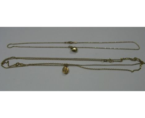 A Modern Heart Pendant, stamped "375", on a chain; a coffee bean pendant on chain and a further chain.