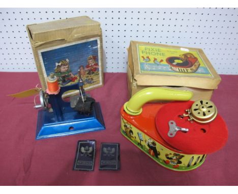 A Mid XX Century Child's 'Pixie Phone', by Gama and a little Betty sewing machine, both boxed.