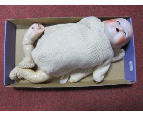 A Bisque Headed Baby Doll, with sleepy eyes and open mouth. Head stamped 'Made in Japan' 500/2½K. With jointed composition bo