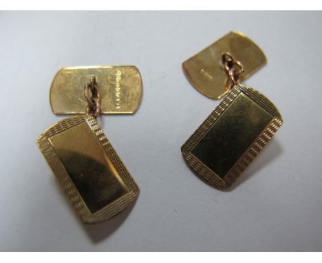 A Pair of 9ct Gold Engine Turned Gent's Cufflinks, on chain connections. 