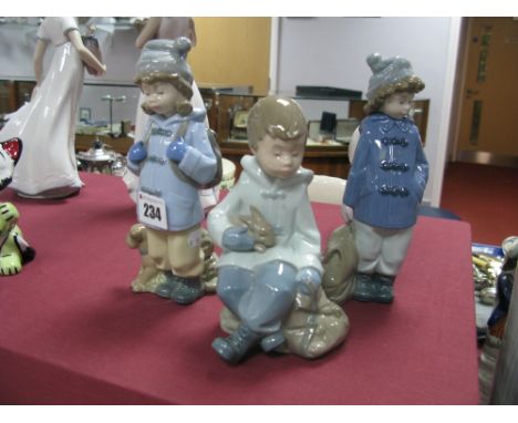 Three Nao Figures - Girl and Boy Hikers and a Boy Resting, all boxed. (3)