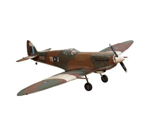 LARGE MODEL SPITFIRE with pilot in the cockpit, in green camouflage, with landing gear and K-series propellor