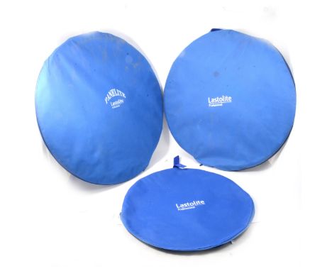 Three Lastolite Professional collapsable light reflectors for photography.