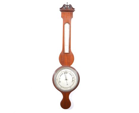 A mahogany cased aneroid wall barometer, banjo case with scrolled pediment, silvered dial, thermometer over, 100cm.