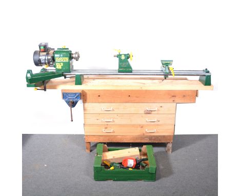 Record CL3 48" wood turning lathe, 240v, and numerous accessories, and a work bench with four drawers and attached quick rele