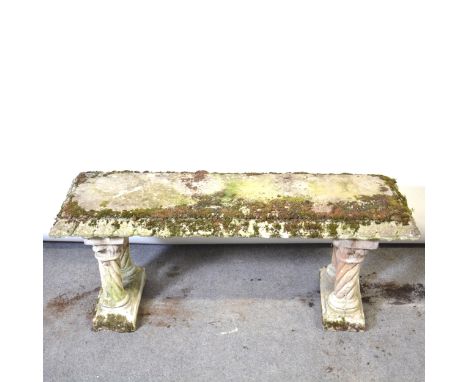 A reconstituted stone garden bench, straight rectangular top, on twin supports, length 123cm.