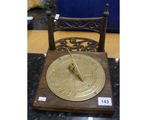 Old boot scrapper & brass sundial
