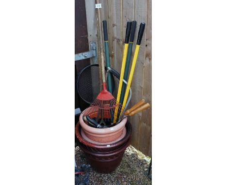 Collection of garden pots and garden tools