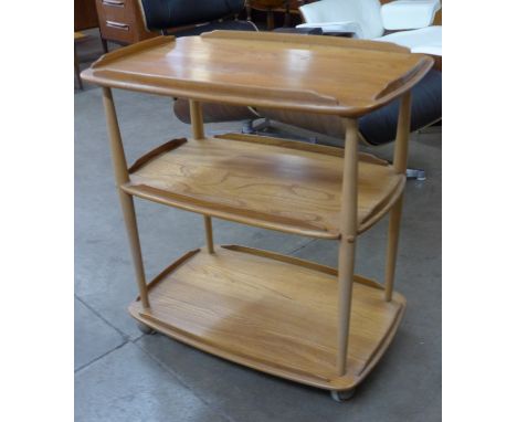 An Ercol Blonde elm and beech Windsor trolley 