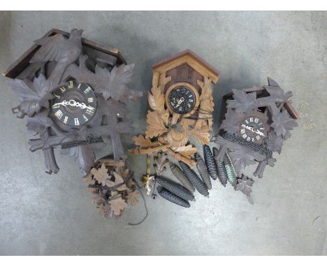 Four vintage Black Forest wall hanging cuckoo clocks 