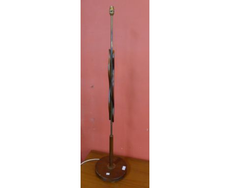 A teak standard lamp 