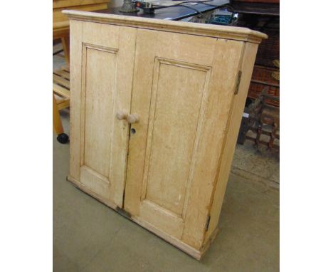 A pine wall hanging fitted ticket cupboard 