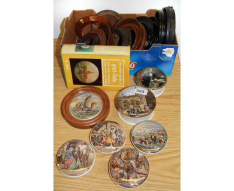 A collection of Victorian Prattware pot lids and display frames.