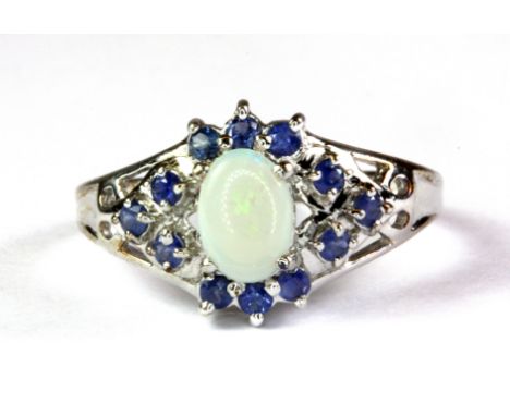 A 9ct white gold opal and sapphire cluster ring, (P).