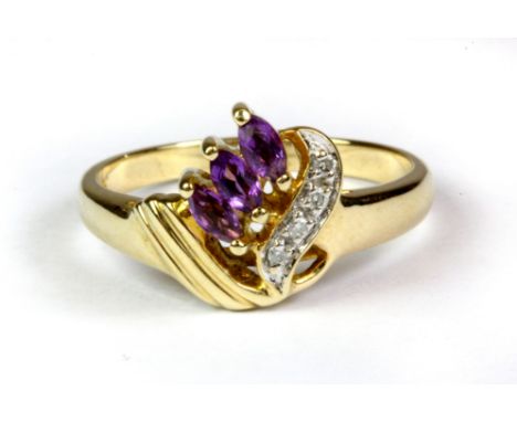 A 9ct yellow gold amethyst and diamond set ring, (P).