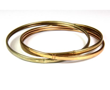 Three yellow metal (tested minimum 9ct gold) Russian style bangles, (approx. 13.4gr).