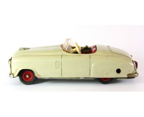 A Schuco Examico II 404 clockwork tin toy sports car, L. 19cm.