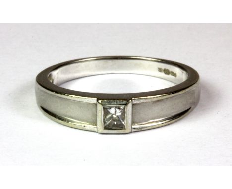 A 9ct white gold diamond set ring, (O.5).