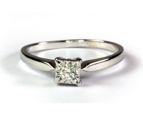 A 9ct white gold diamond set solitaire ring, (Q.5).