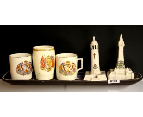 A 1960's ceramic tray, three royal commemorative items and two crested ware items.