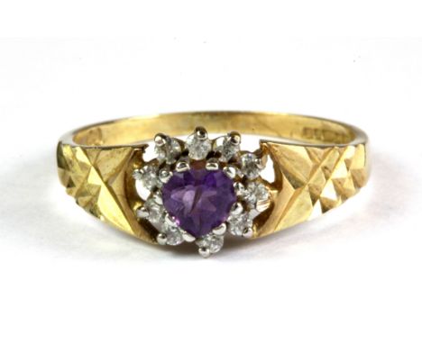 A 9ct yellow gold amethyst and diamond set ring, (L.5).
