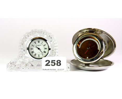 A Waterford Crystal miniature mantle clock (H. 6.5cm), together with a silver plated travelling clock.
