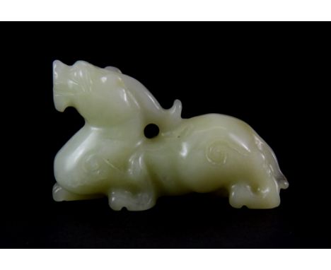 A small Chinese pale celadon nephrite jade figure of a dragon L. 7cm.