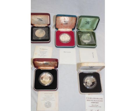 Five cased sterling silver commemorative crowns including 1985 Falkland Islands, 1974 Sierra Leone, 1973 St. Helena etc. (5)