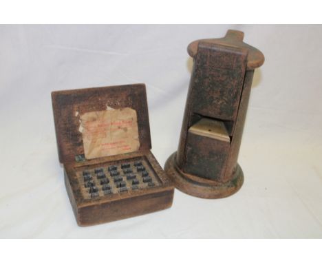 A railway desktop ticket machine and a box of ticket stamps