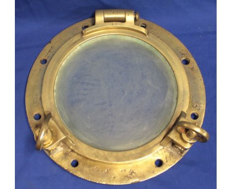 A brass ship's opening light porthole 14½" diameter, originally from the wreck of the SS Rossmore which was bombed and sank o