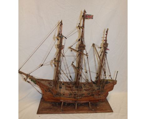 A wooden scale built model of a three-masted gun boat 26" long