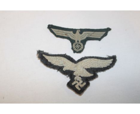 A Second War German Luftwaffe embroidered cloth eagle and a German Army embroidered cloth eagle (2)
