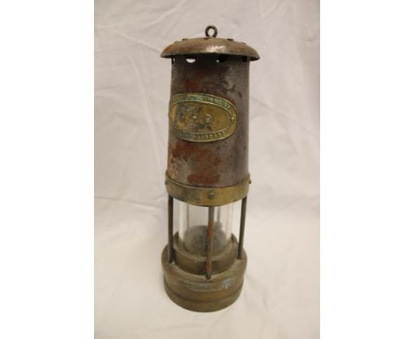 A steel and brass miner's lamp by Thomas and Williams Limited marked "GEO"