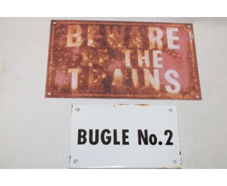 A metal rectangular railway plaque "Beware of the Trains", 6" x 10" and one other enamelled plaque "Bugle No. 2" (2)