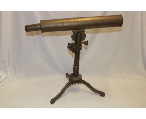 An old brass single-draw telescope, 21" long overall on brass adjusting table tripod