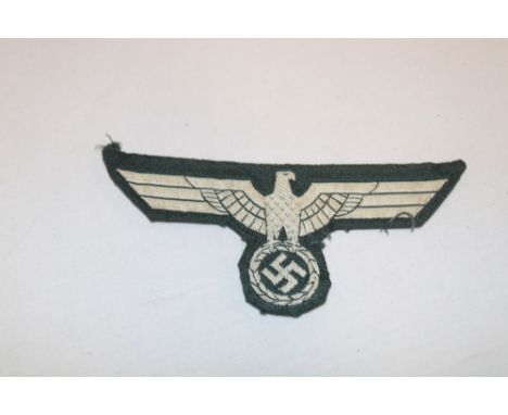 An original German Army Officer's embroidered cotton tunic eagle