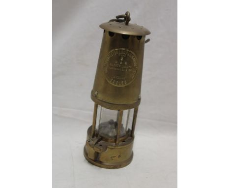 A brass miner's lamp by the Protector Lamp and Lighting Co.