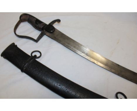 A 1796 pattern Light Cavalry Troopers sabre with 33" curved blade by Gill, steel stirrup guard in steel scabbard