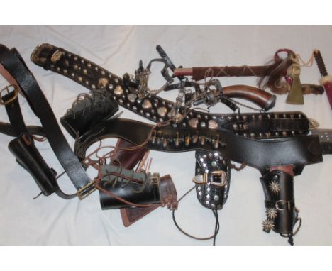 A selection of various Western-style holsters and gun belts together with modern tomahawk, powder flask and accessories