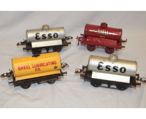 Hornby 0 gauge - four various petrol tank wagons including Shell, Esso etc.