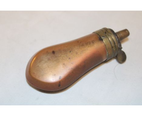 A 19th century brass mounted copper pistol powder flask