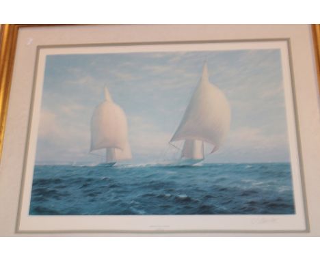 A coloured racing yacht print "Rainbow And Endeavour" after J. Steven Dews, signed by the artist, framed and glazed