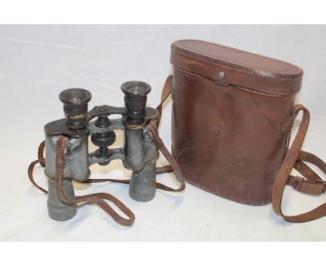 A pair of First War military binoculars by T. Coppock of London in leather case