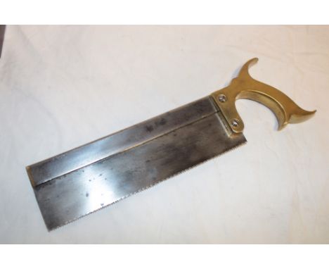 An early 19th century military surgeon's amputation saw by M. A. W. of London, 8½" blade and brass handle bearing the broad a