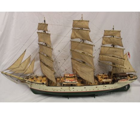 A wood and composition scale built model of a Danish three-masted sailing vessel in full sail with deck detail 39" long overa