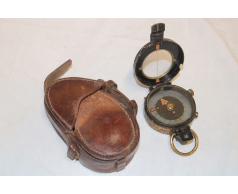 A First War brass mounted pocket compass by Watts &amp; Sons dated 1916 in fitted leather case dated 1915
