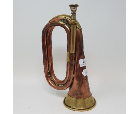 A brass and copper bugle, stamped Henry Potter & Co, 1917 