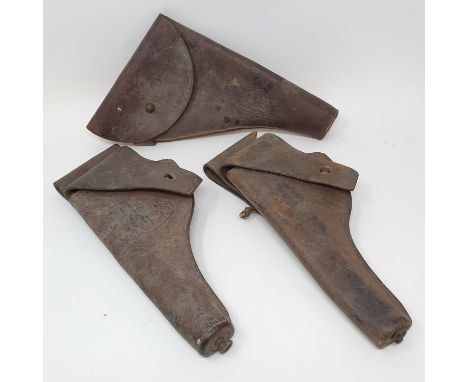 A US Army issue leather pistol holster, 1917, another 1918, and another similar (3) 