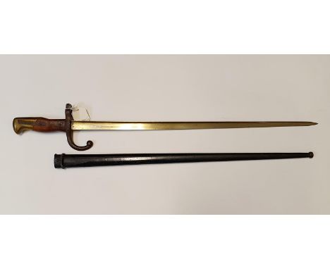 A late 19th century French bayonet, dated 1876, and a scabbard, 66 cm 